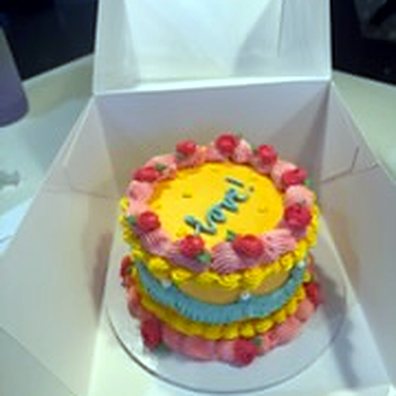 A boxed mini cake ready for delivery