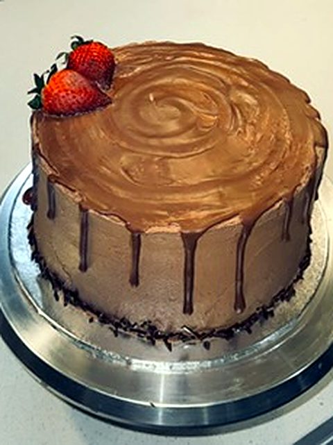 Chocolate drip cake with strawberries