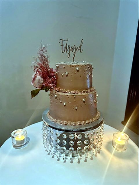 Two-tier engagement cake with pearls
